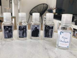 Small bottles with personalized labels on a marble surface